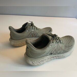 Size 11. Men’s New Balance Fresh Foam 1080v12. Light grey/tan with gold logo